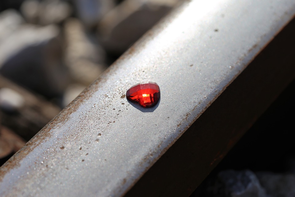 glowing-red-heart-on-railway-2678651_960_720