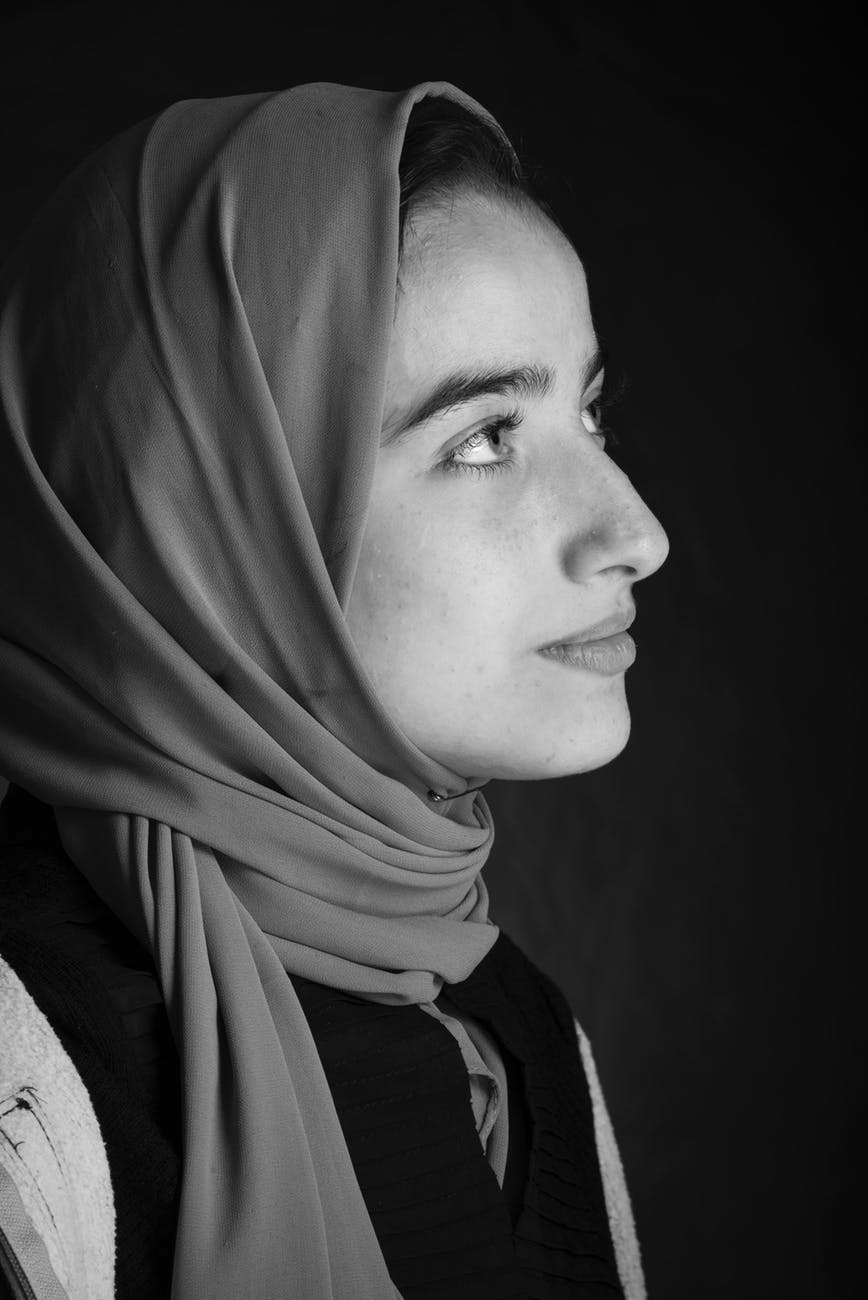 monochrome photo of woman in headscarf