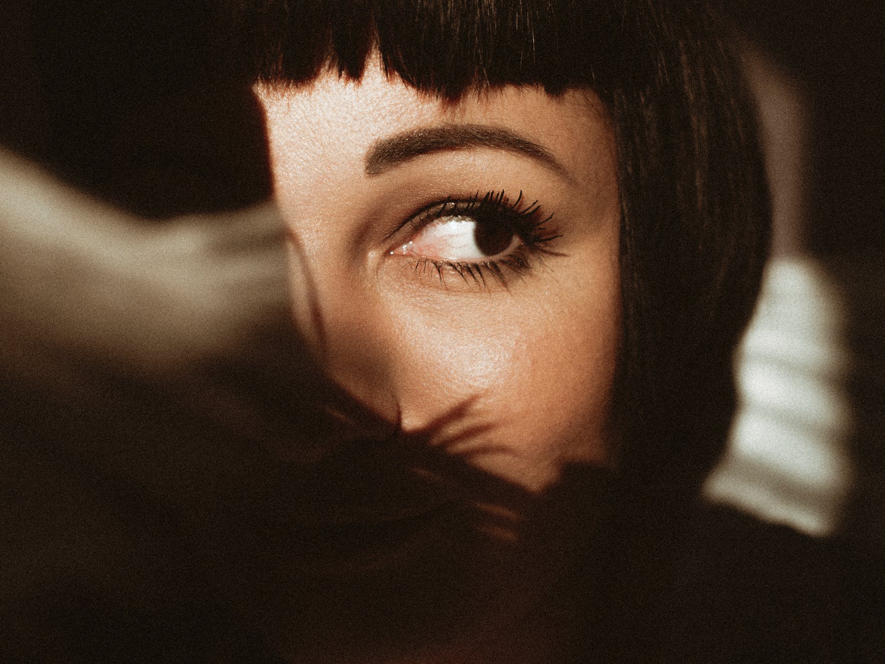 close up photo of woman looking away